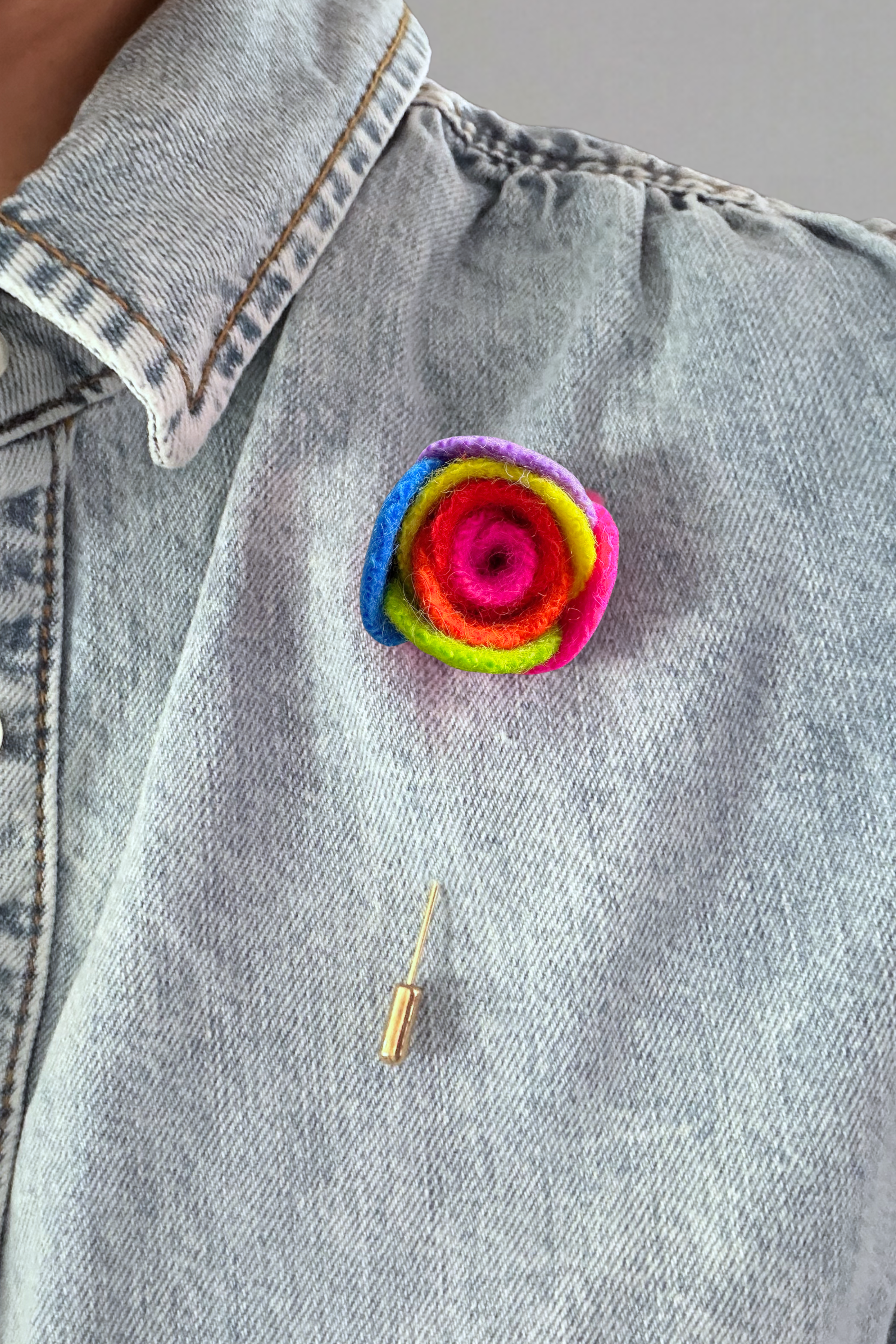 Wool felt ranunculus floral lapel pin in multicolour wool